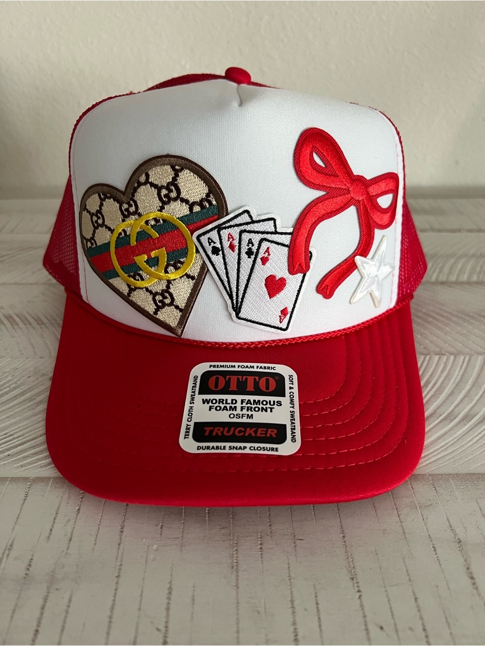 Hat with playing card and heart patches